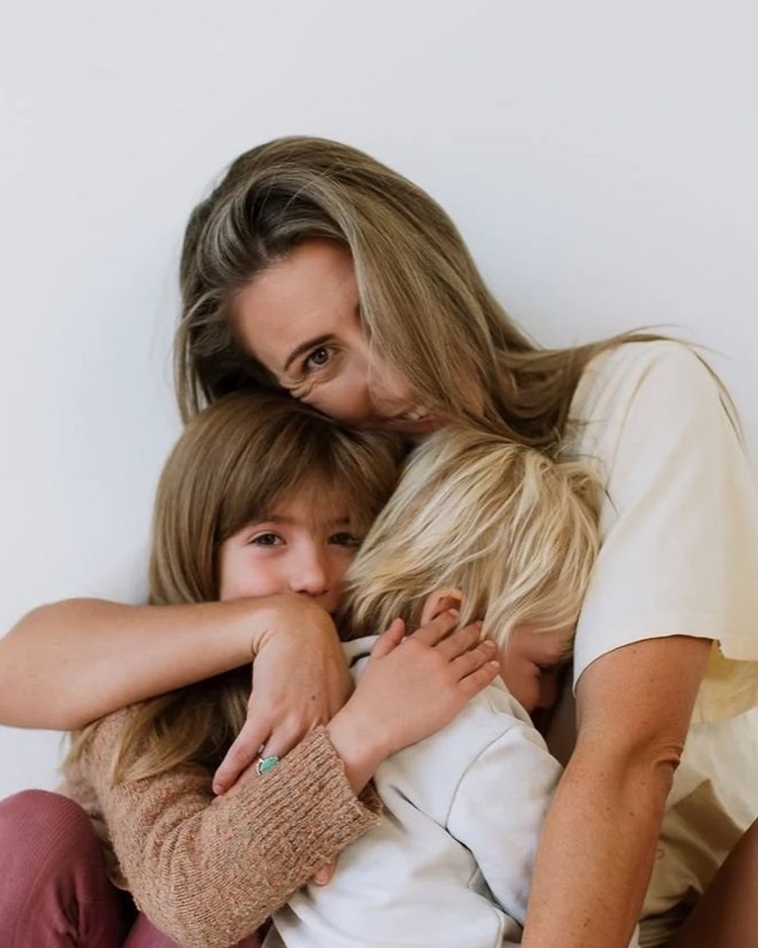 A parent and child in a warm embrace.